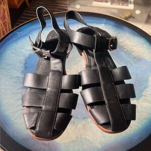 Deltan black leather sandals with adjustable buckles